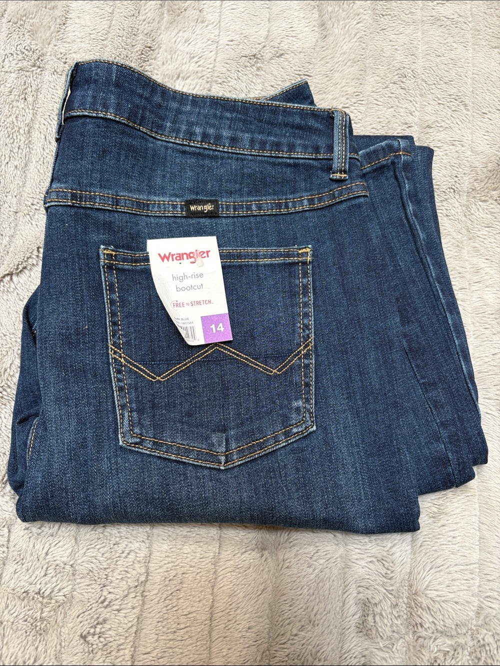 Women’s Wrangler High-Rise Bootcut Jeans in Dark Indigo Blue free to stretch